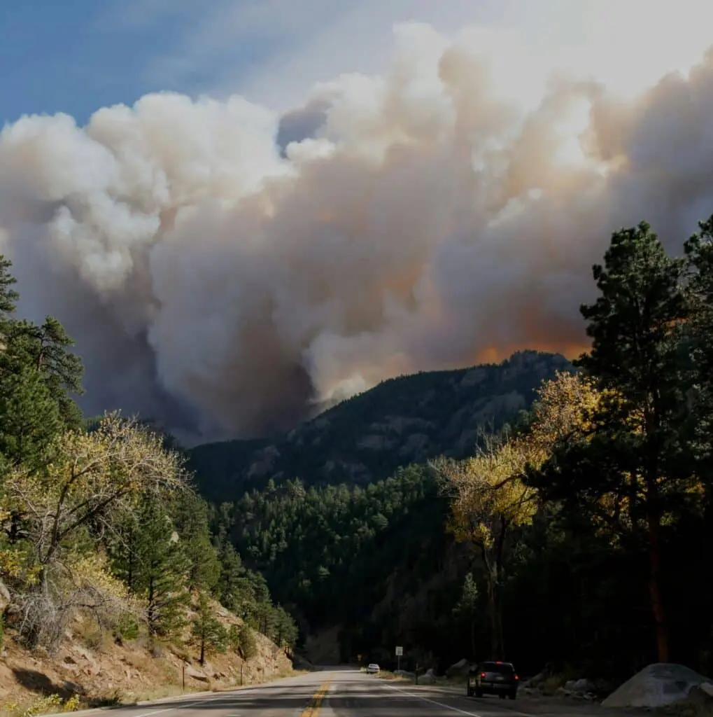 View of wildfire on a mountain in the distance.