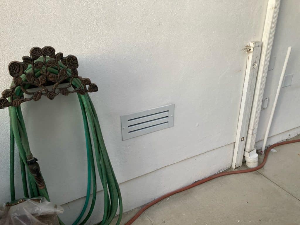 Painted fire-resistant foundation vent in California